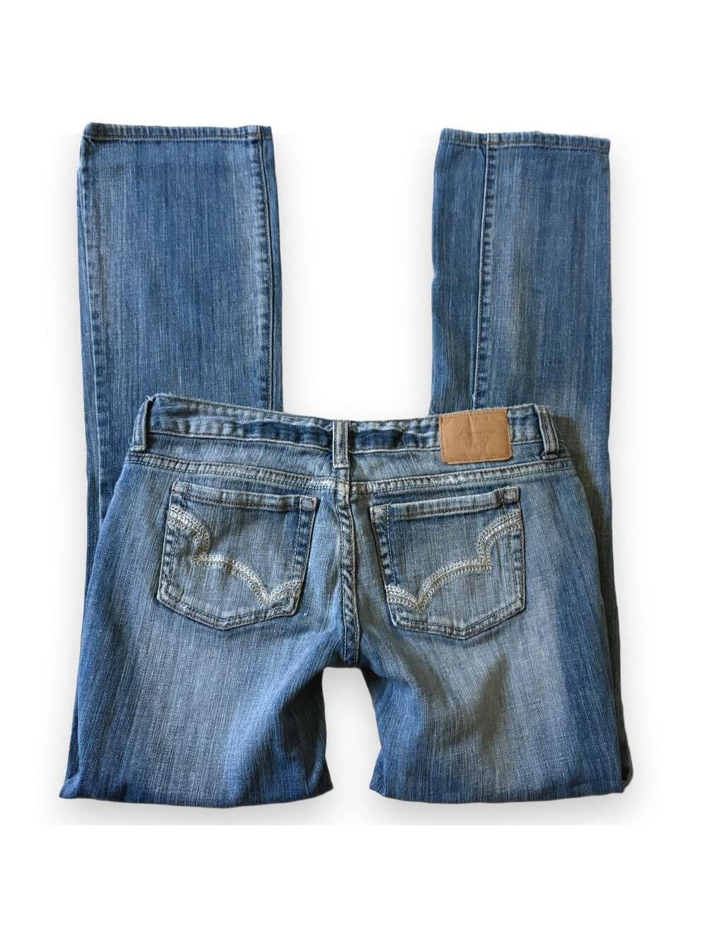 y2k low rise flared light vintage wash jeans with white embroidery